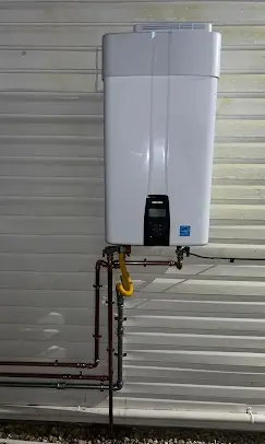 New outdoor tankless water heater installed by Serrano's Plumbing Services