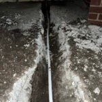 Southeast Louisiana water line repair with concrete cut open to access an underground water line