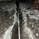 Southeast Louisiana water line repair with concrete cut open to access an underground water line