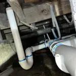 Neatly hung sewer piping installed in a residential crawl space