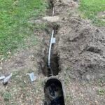 New water line trench and water main installation at a residential property