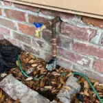 Southeast Louisiana water line repair showing underground pipe access and plumbing restoration outside the home