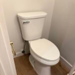 Toilet installation in a residential bathroom in South Shore Louisiana home